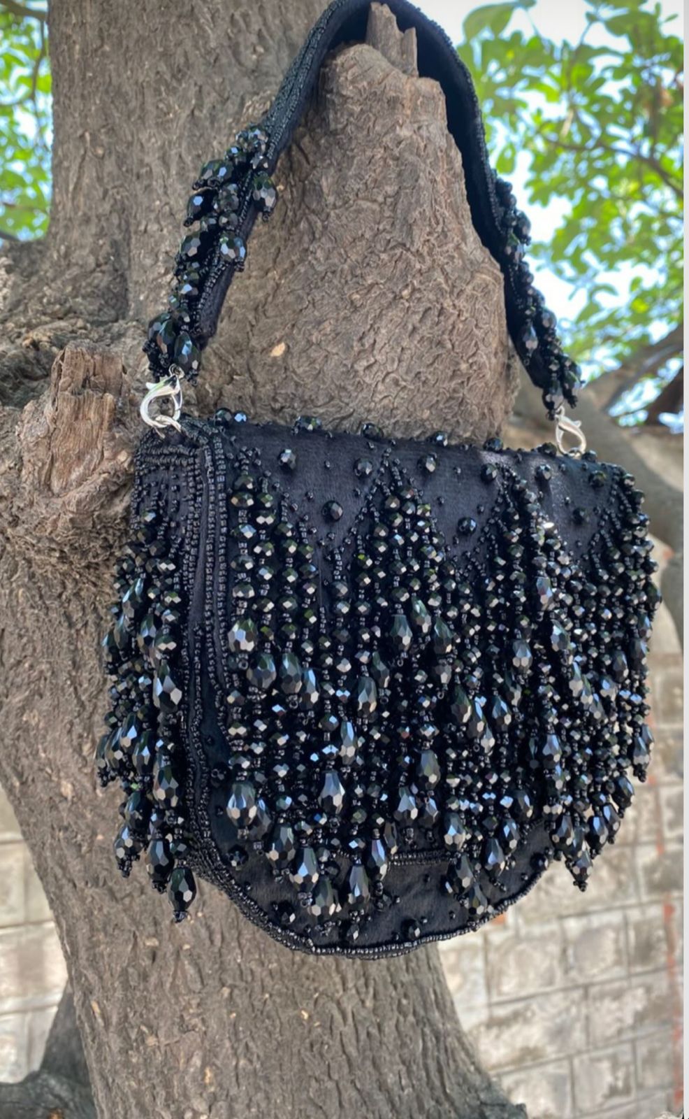 Emerald Cascade Fringe Clutch